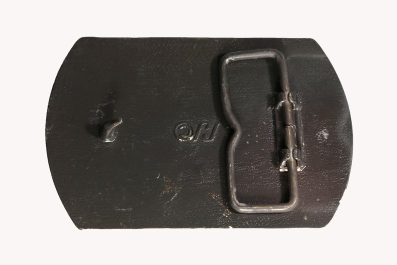 May include: A black leather belt buckle with a silver metal buckle and the letters "OJ" engraved on the front.