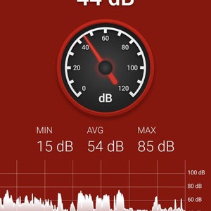 May include: A red screen displays a sound level meter app. The meter reads 44 dB, with a needle pointing to the 44 mark on a circular gauge. Below, a graph shows sound levels over time. Text includes "Schallmessung", "INFO", and "RESET".