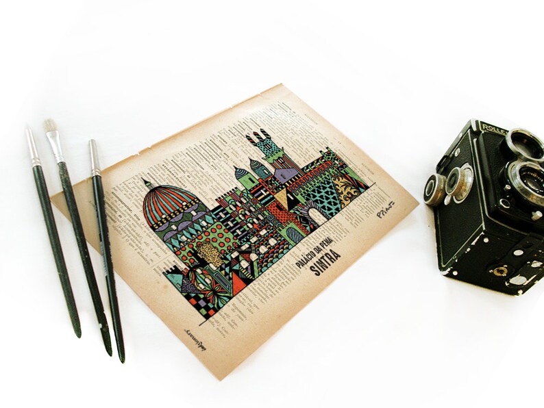 May include: A colorful illustration of the Palacio da Pena in Sintra, Portugal, printed on a vintage book page. The illustration is in a whimsical style with geometric shapes and patterns. The text "Palacio da Pena, Sintra" is printed below the illustration.