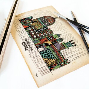 May include: A colorful illustration of a building with the text "PALACIO DA PENA SINTRA" printed below. The illustration is on a page of a vintage book with a ruler and paintbrushes on the page.