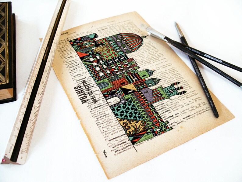 May include: A colorful illustration of a building with the text "PALACIO DA PENA SINTRA" printed below. The illustration is on a page of a vintage book with a ruler and paintbrushes on the page.