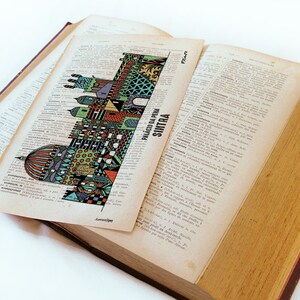 May include: A colorful illustration of the Palacio da Pena in Sintra, Portugal, printed on a page of a vintage dictionary.