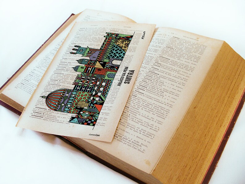 May include: A colorful illustration of the Palacio da Pena in Sintra, Portugal, printed on a page of a vintage dictionary.