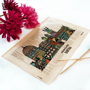 May include: A vintage style illustration of the Palacio da Pena in Sintra, Portugal. The illustration is printed on a page of a book with text in Portuguese. The illustration is in a colorful, geometric style.