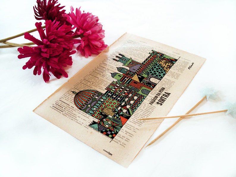 May include: A vintage style illustration of the Palacio da Pena in Sintra, Portugal. The illustration is printed on a page of a book with text in Portuguese. The illustration is in a colorful, geometric style.