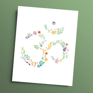 May include: A white background with a colorful floral design in the shape of the Om symbol.