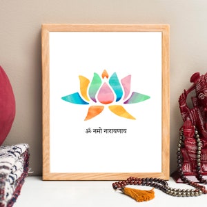 May include: A framed print with a watercolor illustration of a colorful lotus flower and the text "Om Namo Narayanaya".