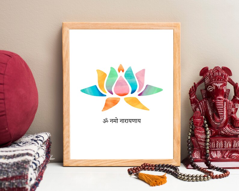 May include: A framed print with a watercolor illustration of a colorful lotus flower and the text "Om Namo Narayanaya".