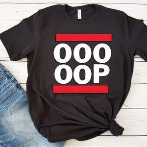 May include: Black t-shirt with a white graphic that says "OOO OOP" with red lines above and below the text.