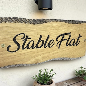 Personalised oak wooden house sign with garden background UK handmade exterior plaque