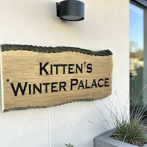 uxury oak address sign mounted on modern UK home exterior personalised wooden plaque