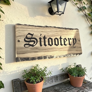 Cottage style personalised oak house name plaque handmade in UK mounted on exterior wall