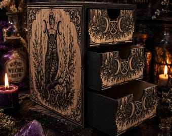 May include: A wooden storage chest with three drawers featuring black laser-engraved designs. The side panel displays an owl perched on a branch beneath moon phases and a pentagram. Each drawer front is decorated with a triple moon and pentagram motif.