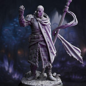 May include: A detailed figurine of a character in a fantasy outfit. The figure is clad in armor, a long coat with button details, and boots. The character is holding a staff with a flowing cloth and has one arm raised. The color is a muted purple.