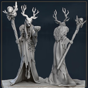 May include: A gray figurine of a figure with a deer skull head, antlers, and a long flowing robe. The figure holds a staff topped with skulls and a bowl. The figure is shown from the front and back.