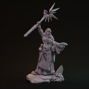May include: A white painted miniature figurine of a female figure wearing a robe and holding a staff with a starburst design. The figure is standing on a rocky base.
