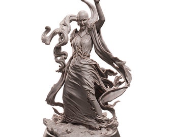 May include: A gray, detailed, sculpted figurine of a woman with long hair and a flowing robe. She is standing on a rocky base with her arms raised, as if casting a spell.