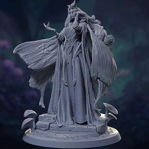 May include: A gray figurine of a woman with long flowing hair, a crown, and large, detailed wings. She is holding a small butterfly. The figure is standing on a base with mushrooms and steps, creating a fantasy theme.