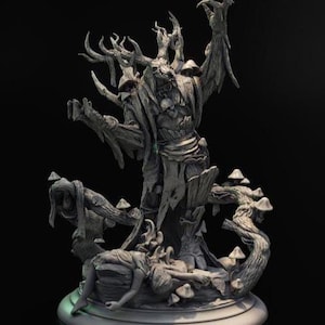 May include: A detailed gray sculpture of a tree-like figure with outstretched arms, antlers, and a skull-like face. The sculpture includes a figure lying at the base, with mushrooms and twisted branches. The base is round.