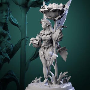 May include: A gray, detailed sculpture of a female figure with pointed ears, standing with a large flower and leaves. The figure is wearing a dress with a belt and holding a small flower in her hand.