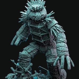 May include: A detailed, gray-toned sculpture of a scarecrow-like figure. The figure has a pumpkin-shaped head with a spiky crown and a stitched mouth. Its body is constructed from bundled straw and wooden elements, with wrapped twine details.