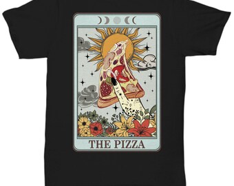 May include: A black t-shirt featuring a graphic print of a tarot card design. The illustration shows a hand holding a slice of pizza against a sun and moon background with flowers at the bottom. The text THE PIZZA is printed at the bottom.