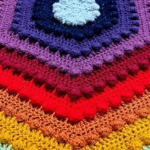 rainbow coloured bath mat made with crochet