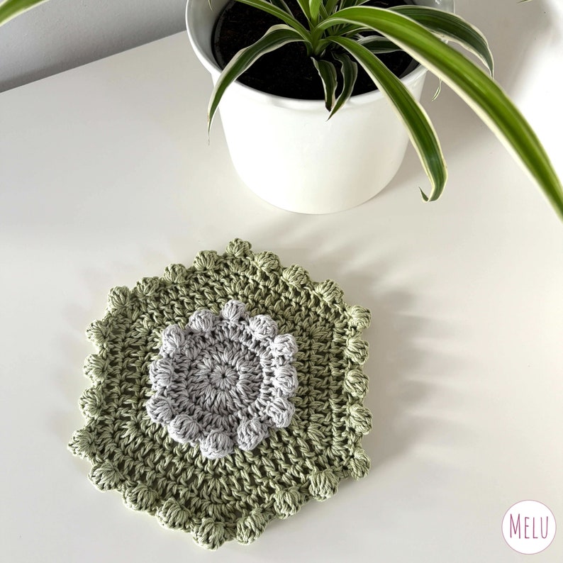 a pattern that starts with a face scrubby, then grows to a washcloth, shower mat, bath mat and finally a bath runner.