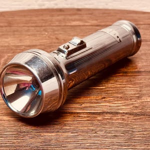 Retro Chrome-Plated Torch: Vintage Illumination Device for Collectors and Outdoor Enthusiasts