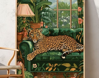 May include: A green velvet sofa with a leopard print lying on it. The sofa is in a room with a large window and lush green plants. The room is decorated with a floral pattern.