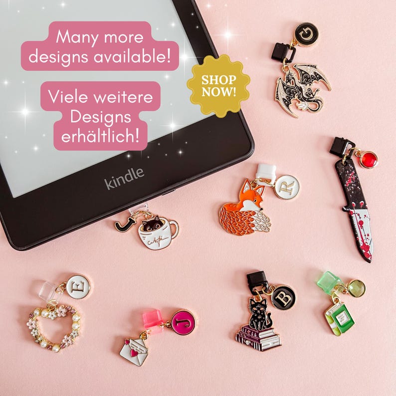 May include: A collection of decorative Kindle page holders in various designs, including a fox, a cat in a teacup, a dragon, a knife, and a heart. The image also includes the text "Many more designs available!" and "SHOP NOW!"