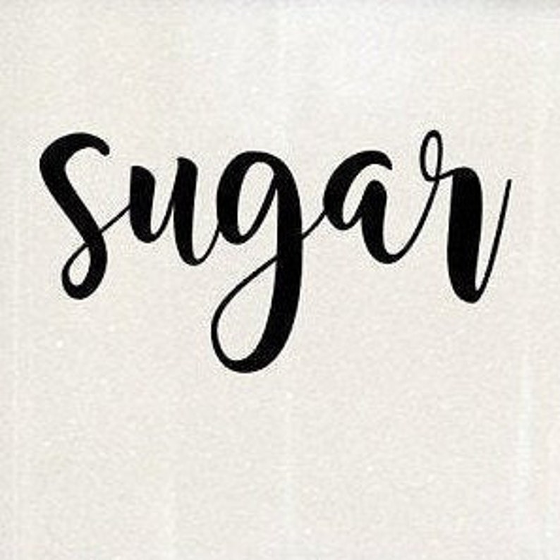 May include: A white ceramic jar with black cursive lettering that reads "Sugar".