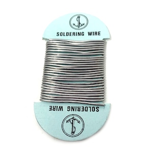 May include: A roll of silver soldering wire on a blue card with an anchor logo and the text "SOLDERING WIRE".