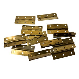 May include: A selection of antique brass hinges, each featuring multiple screw holes for secure fitting. The rectangular hinges are folded in the centre, displaying a warm, aged patina. Suitable for furniture restoration or craft projects.