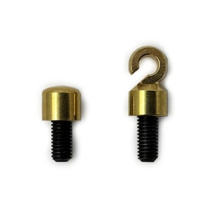 May include: Two brass screw-in hooks with black screws. One hook has a round top and the other has a hook shape.