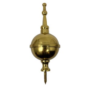 May include: A gold-coloured finial with a spherical body and a decorative top. The finial has a screw at the bottom for easy installation. This decorative element is suitable for furniture or architectural accents.