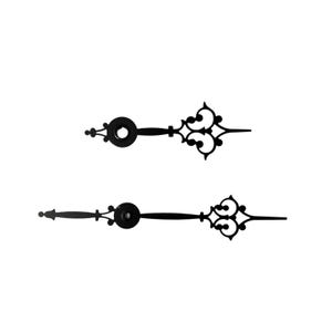 May include: Two black metal clock hands with ornate designs at the ends. The hands are for a clock with a standard size shaft.