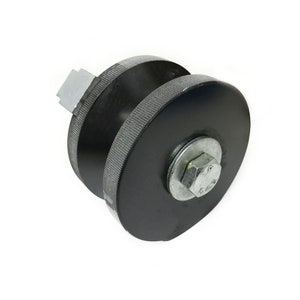 May include: Black metal gate roller with a silver bolt and a grooved wheel.