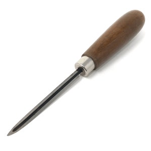 May include: A small scraper tool with a thin, metal blade and a wooden handle. The blade is sharp and pointed, and the handle is brown and smooth.
