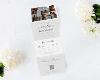 May include: A folded wedding invitation with photos, names, and event details. The invitation is light gray with black text and features a timeline of events. The top panel displays photos with the date "06.14.26". White flowers and greenery are in the background.