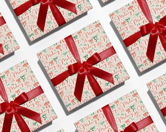 May include: Several gift boxes wrapped in patterned paper with red bows. The paper has a repeating pattern of bows in red, green, and pink, with the name "Malang" written in red script. The boxes are tied with wide red satin ribbons.
