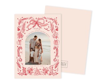 May include: A holiday greeting card with a family photo framed by a red illustrated border of festive elements. The text reads "Wishing you the most joyous holiday season" and "The Smith Family". The card is light pink.
