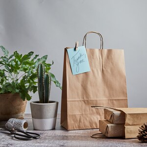 White paper twisted handle bags are perfect for any occasion! These are great for party bags, wedding favours, retail merchandise bags, and more. These paper party bags come in a variety of 6 sizes from Extra Small to XXL to carry all your gifts.