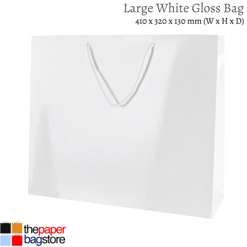 May include: A large white gloss gift bag with a white rope handle. The bag measures 410 x 320 x 130 mm (W x H x D).