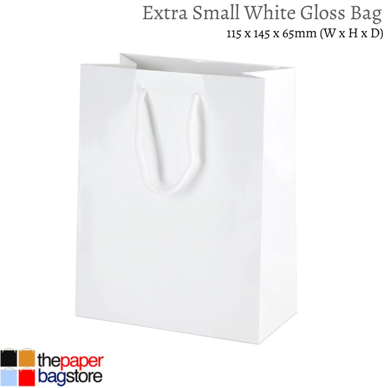May include: White gloss paper gift bag with a white rope handle. The bag measures 115 x 145 x 65 mm (W x H x D).