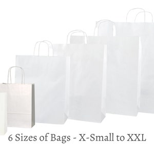 May include: Six white paper bags of different sizes, from X-Small to XXL. The bags are lined up from smallest to largest.
