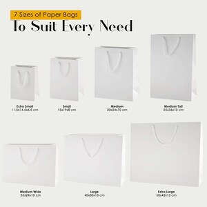 May include: Seven white paper bags with rope handles in various sizes, labeled with dimensions in centimeters: 11.5x14.5x6.5, 15x19x8, 20x24x10, 25x36x10, 35x24x10, 40x30x13, and 50x42x13. The text reads 7 Sizes of Paper Bags To Suit Every Need.