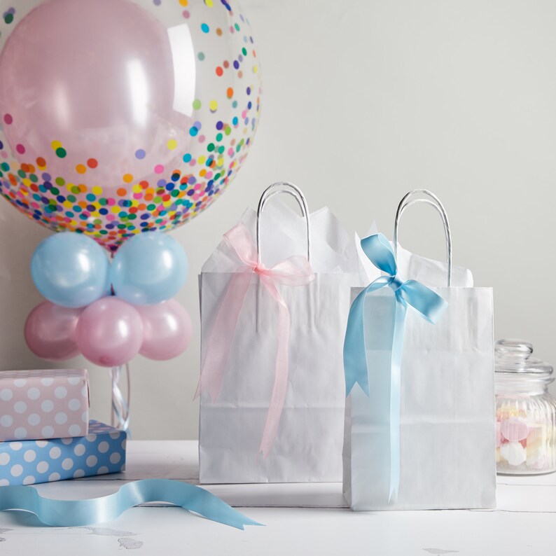 White paper twisted handle bags are perfect for any occasion! These are great for party bags, wedding favours, retail merchandise bags, and more. These paper party bags come in a variety of 6 sizes from Extra Small to XXL to carry all your gifts.