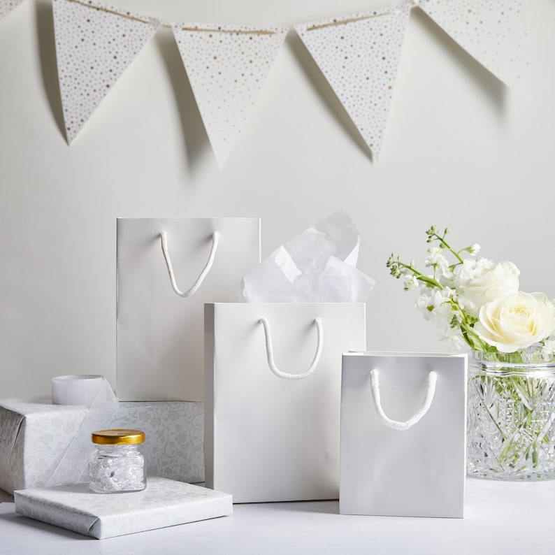 White Luxury Matt Boutique Bags are perfect for any occasion! These are great for party bags, wedding favours, special events, conferences and more. These paper party bags come in a variety of 6 sizes from Extra Small to XXL to carry all your gifts.