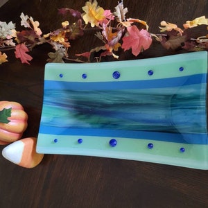 Fused glass rectangle bowl made with green and blue wispy glass in geometric design. This will make a great gift for your special person!